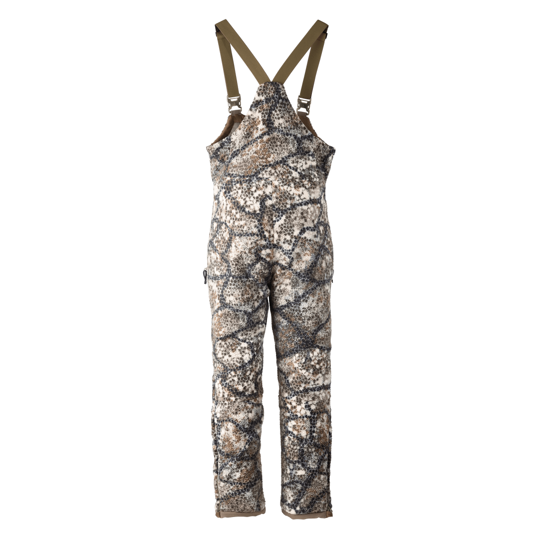 Badlands camo hunting bib with suspenders; features the Badlands skull logo for brand identification.