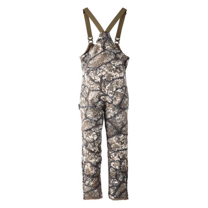 Badlands camo hunting bib with suspenders; features the Badlands skull logo for brand identification.