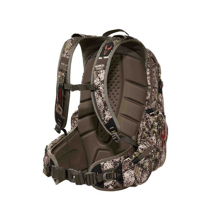 Badlands camo hunting backpack with padded straps and skull logo, designed for comfort and gear organization.