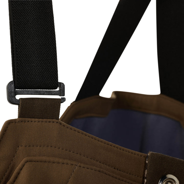 Close-up of a Badlands hunting pack strap and buckle, showing durable stitching and fabric for outdoor use.