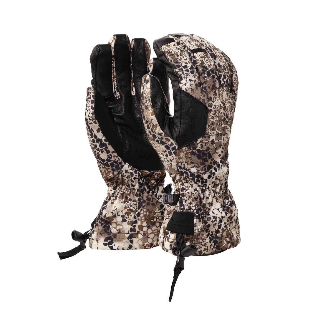 Badlands camo gloves with leather palms and skull logo, designed for outdoor use; adjustable wrist straps included.