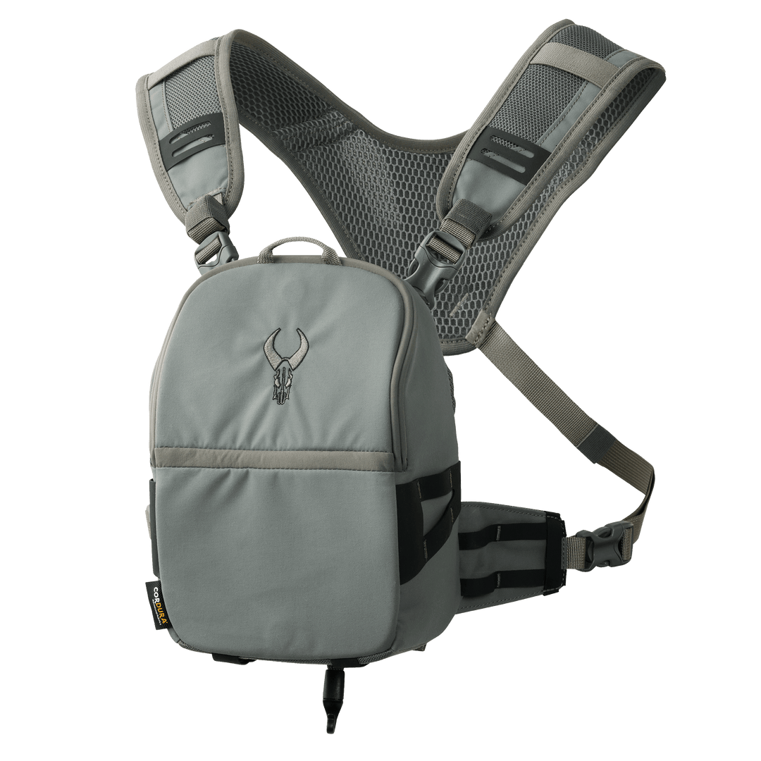 Gray Badlands chest pack with mesh shoulder straps and skull logo, designed for outdoor gear accessibility and comfort.
