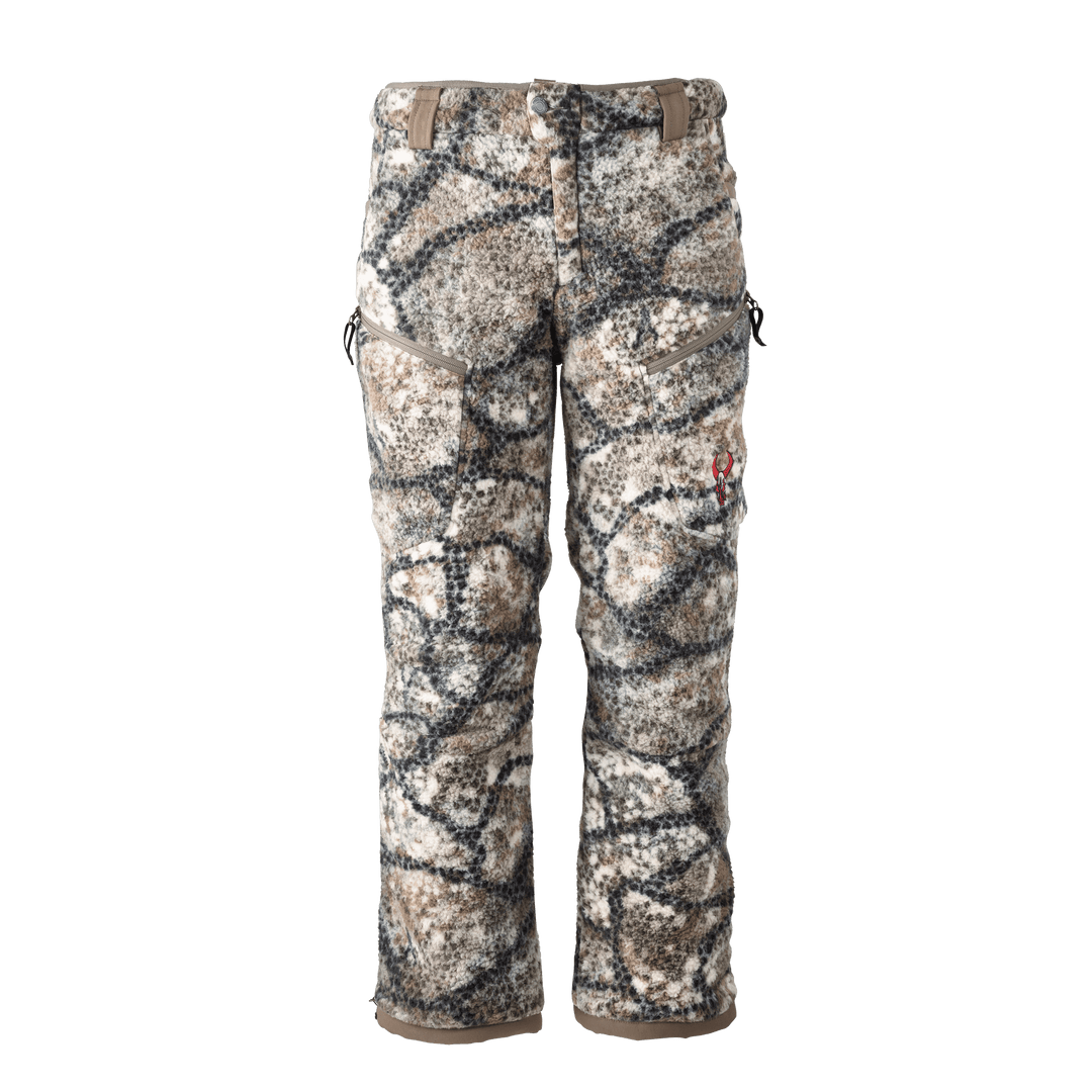 Badlands camo hunting pants with fleece texture and red skull logo on right thigh, shown front view on white background.