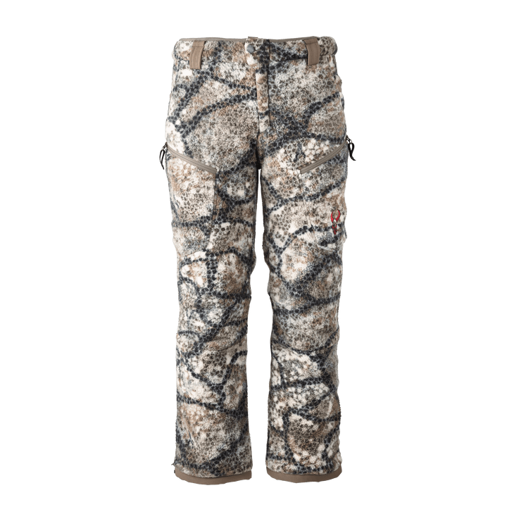 Badlands camo hunting pants with fleece texture and red skull logo on right thigh, shown front view on white background.