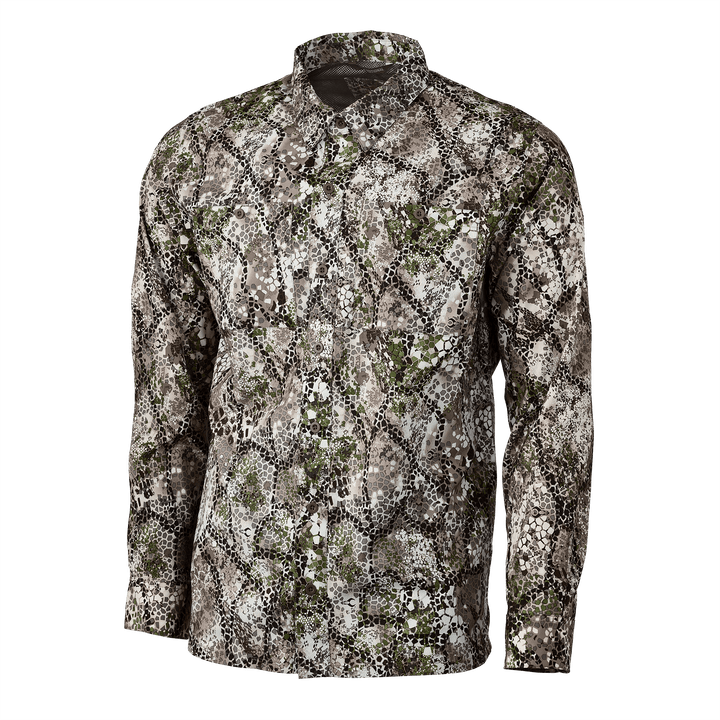Badlands long-sleeve shirt in Approach camo pattern, featuring breathable fabric and subtle Badlands skull logo.