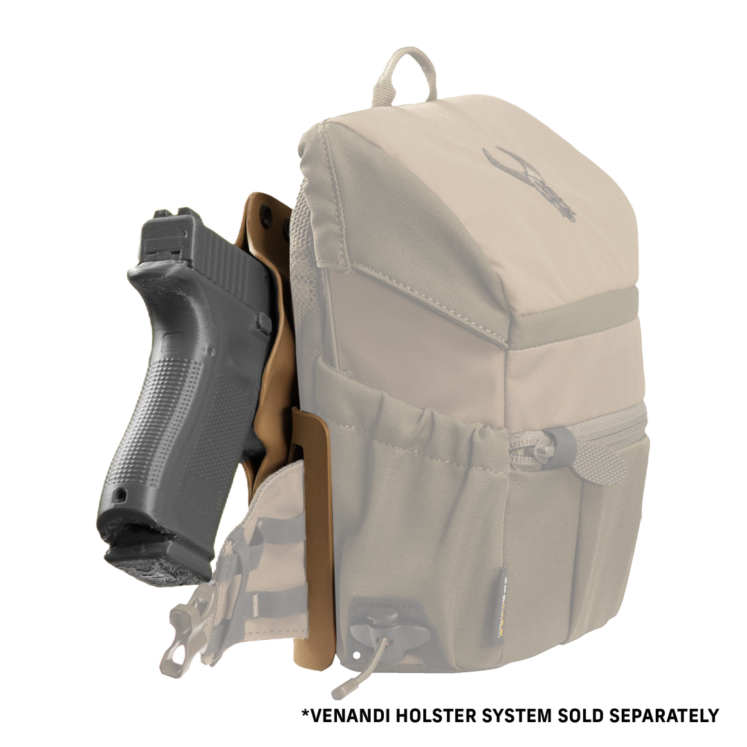 Tan Badlands bino harness with holstered pistol; Badlands skull logo visible on top flap.