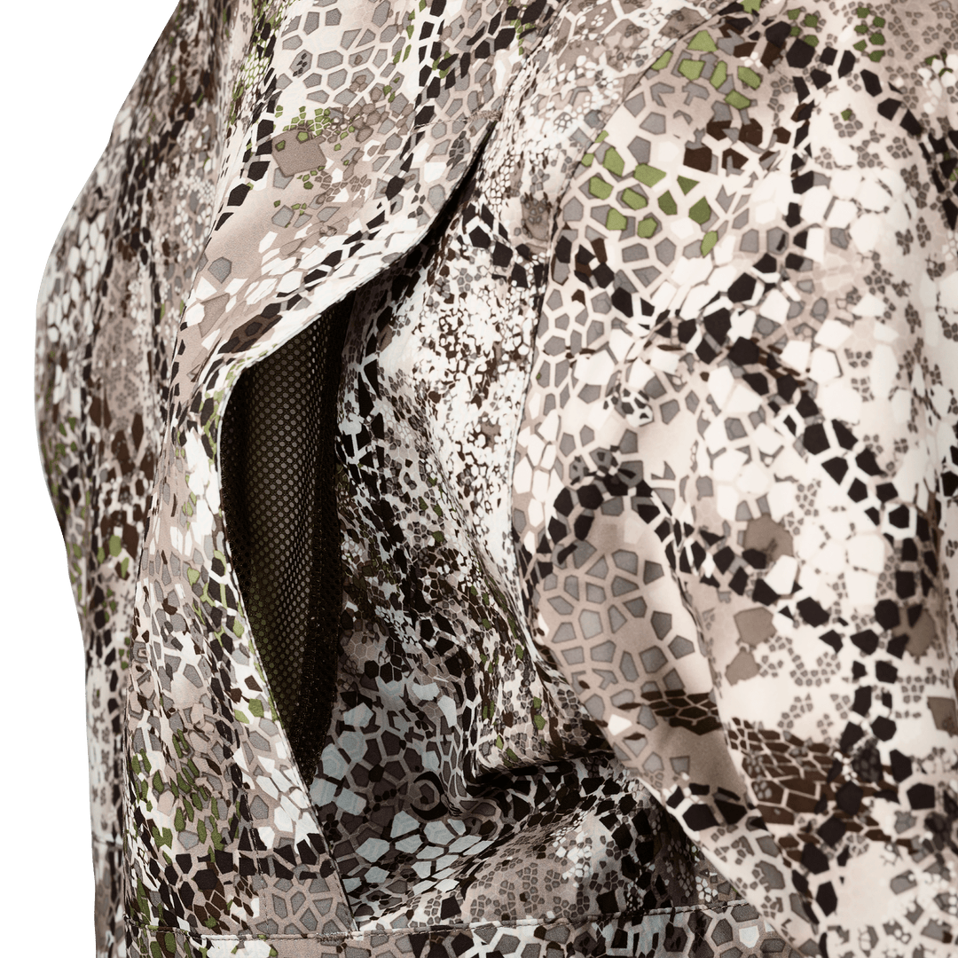 Close-up of Badlands camo jacket with open mesh-lined underarm vent for breathability.